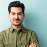 Home man standing against blue background