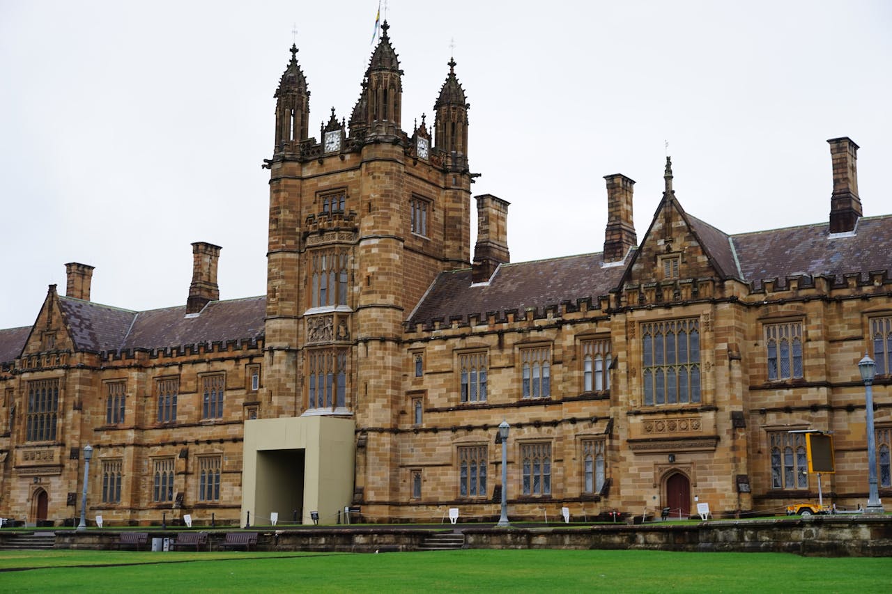 Home Front view of a historic university building with gothic architecture.
